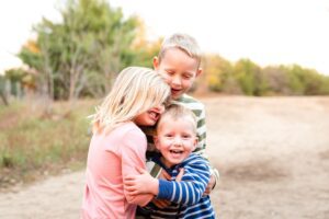 Children Hugging Family Photographer