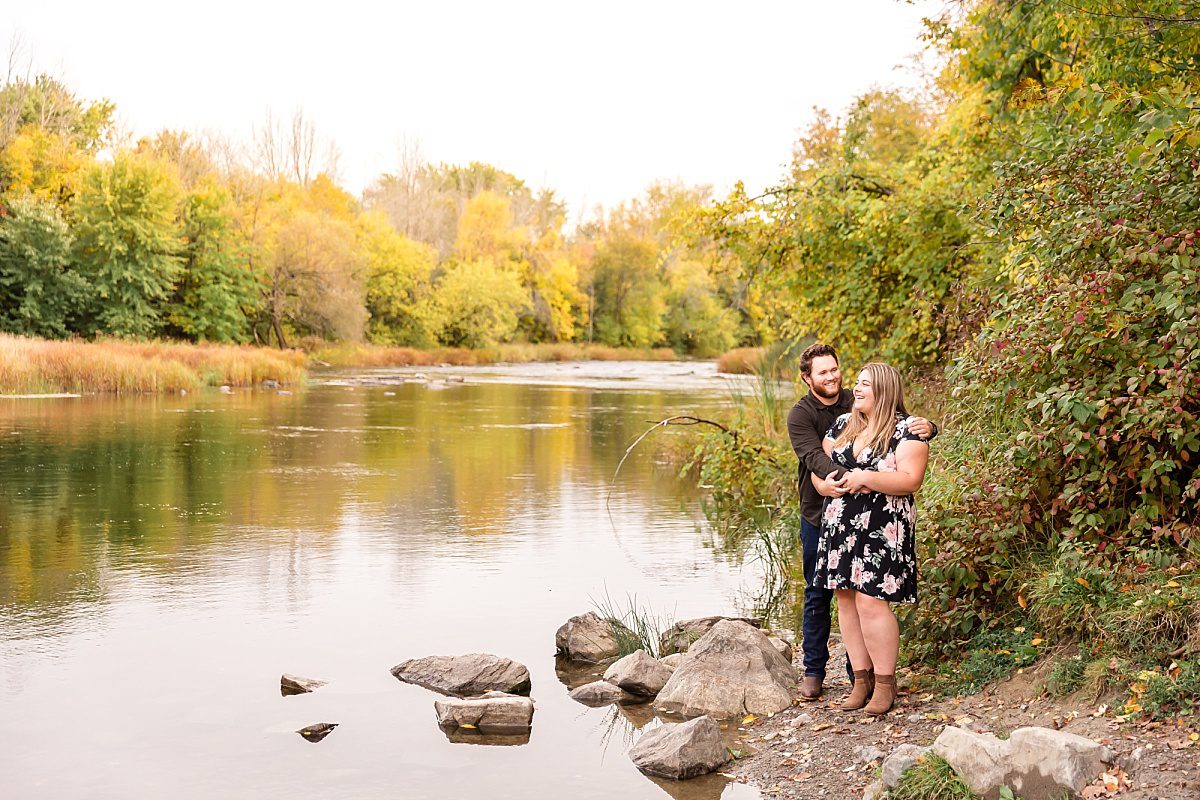 couple standing by water for their engagement portraits in Ottawa, ON - Ottawa, Kingston, Brockville Wedding Photographer