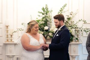 Bride and groom exchange rings at Ceremony House - Stonefields Estate Wedding