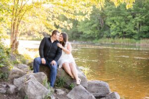 couple by the water during their engagement session in Ottawa, ON