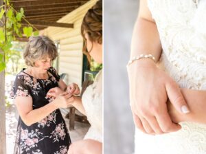 Bride's mother helping her put on bracelet for farm wedding