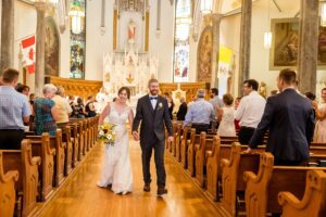 bride and groom wedding recessional at St. Finnan Basilica in Alexandria, ON