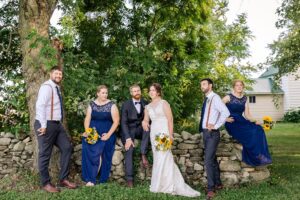 wedding party portraits in front of old barn - farm wedding in Alexandria, ON