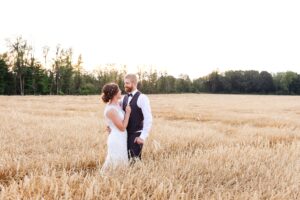 golden hour portraits in wheat field during farm wedding in Alexandria, ON