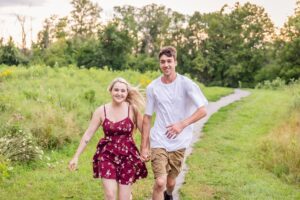couple running towards the camera during fun portrait session
