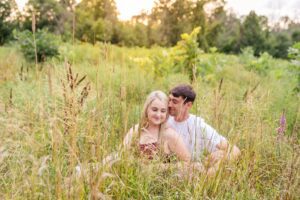 couples portraits in long grass outside Ottawa, ON