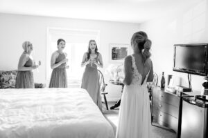 first look with bridesmaids at Strathmere wedding in "the corner" rooms