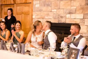 bride and groom kissing during Strathmere wedding reception