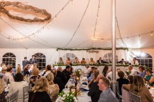 Wedding reception in tent at family farm wedding