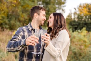 popping champaign during engagement photos