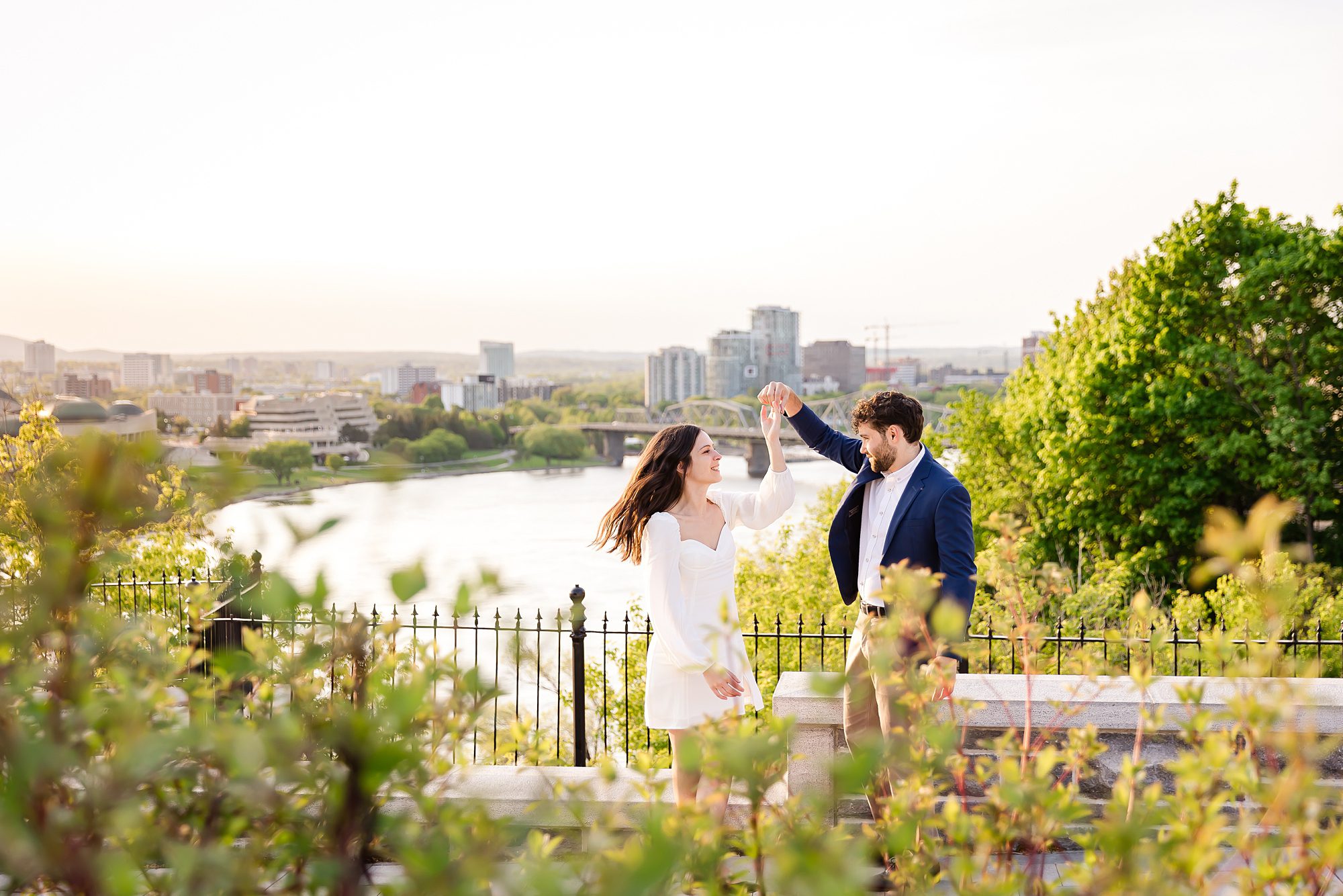 Couple dancing during Downtown Ottawa Engagement Pictures overlooking the Ottawa River
