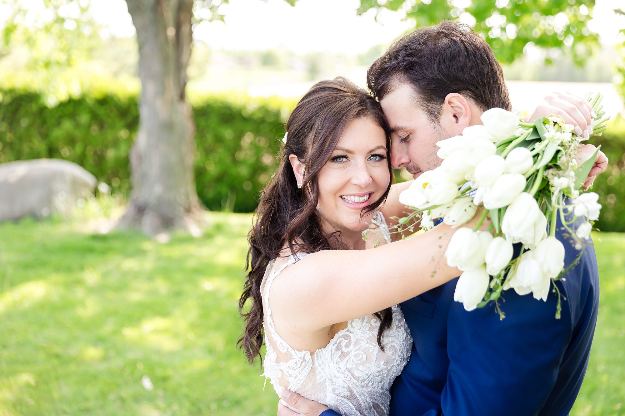 Bride and groom pose during outdoor wedding at StoneCropAcres Winery and Vineyard in Morrisburg, ON