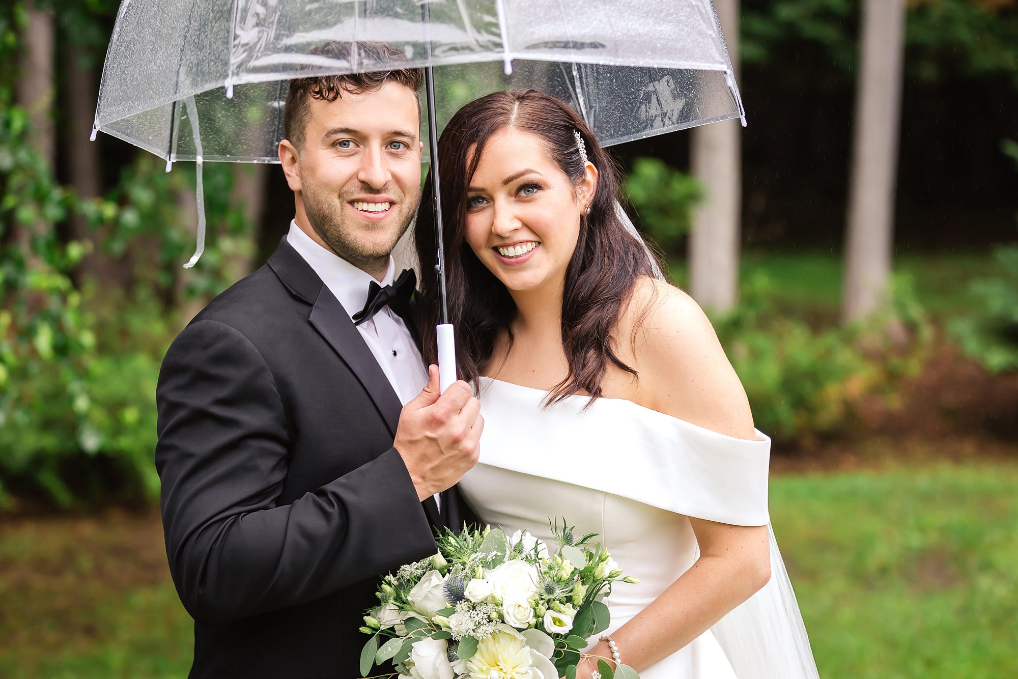 Bride and groom portraits on rainy day wedding