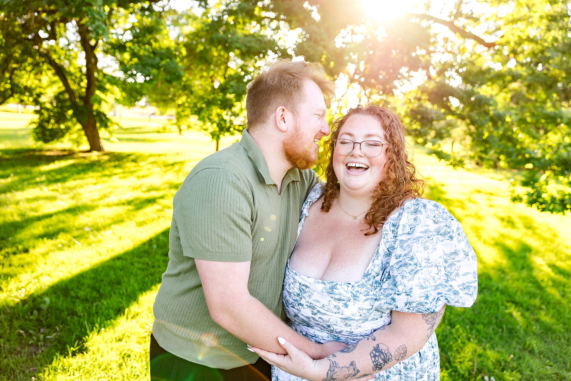 couple laughing during candid engagement pictures