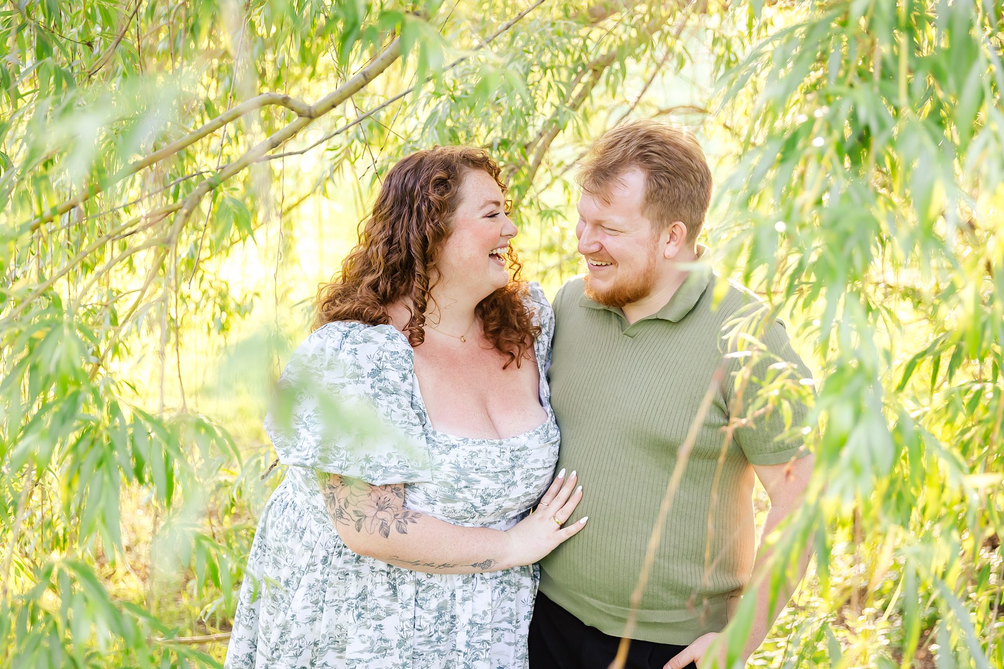 couple laughing during engagement portraits