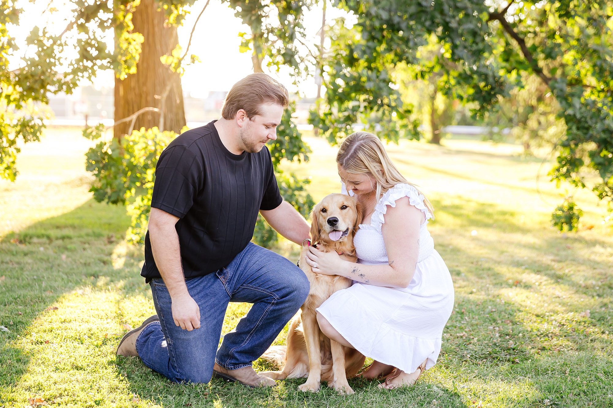portrait of a couple with their golden retriever in Ottawa